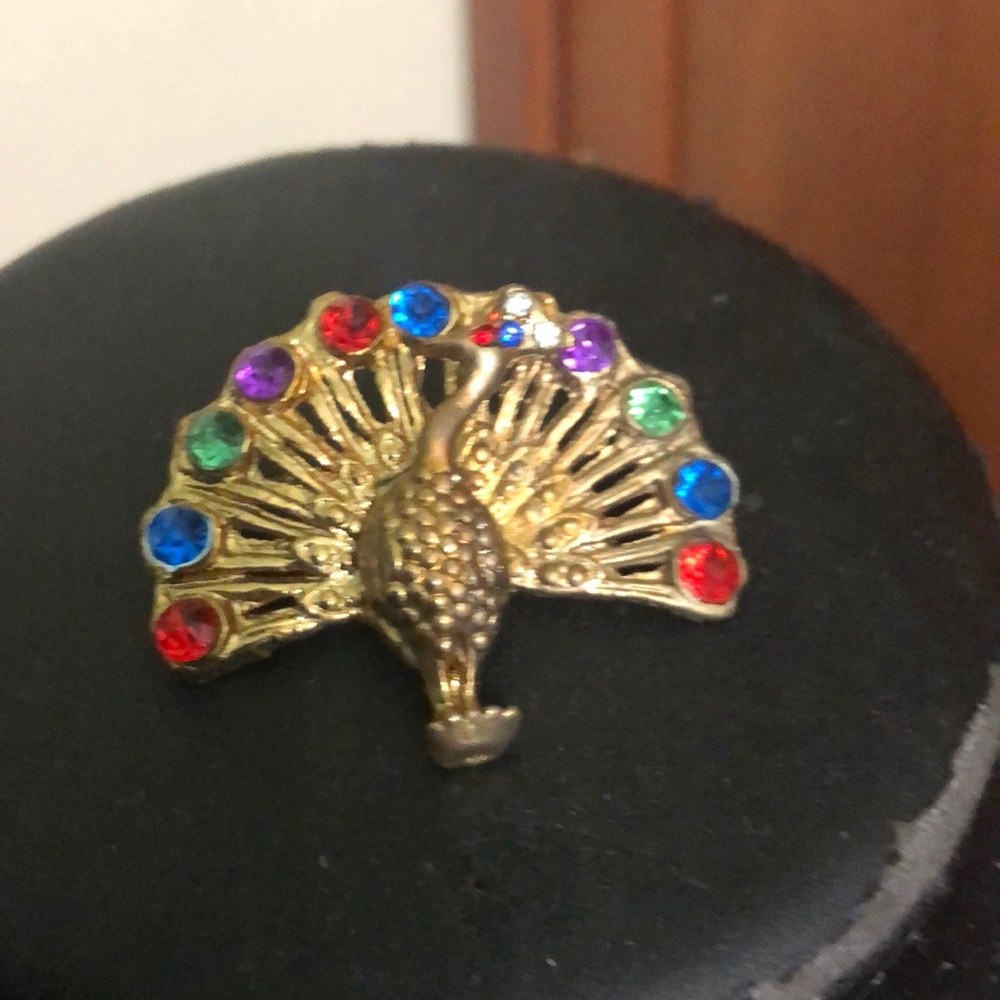 Gold plated peacock pin